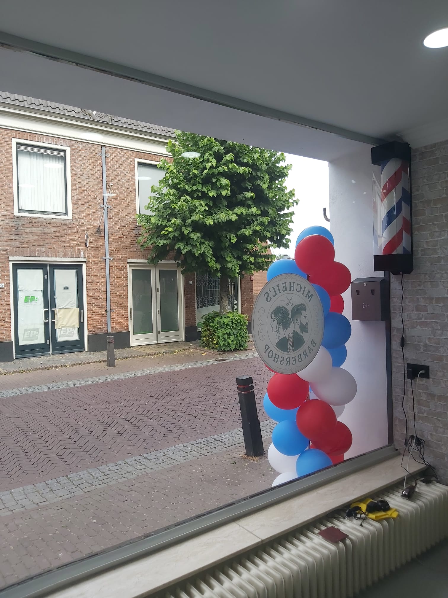 micheils-barbershop-outside-view-from-inside